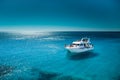 White boat in the sea with clean transparant blue water