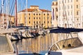 White boats, blue sky and colorful buildings at Piran harbor, Istria