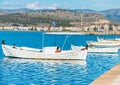 White boats with Greek flag docked in Nafplio city port Royalty Free Stock Photo