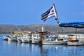 White boats in the Greek gulf, the flag of Greec