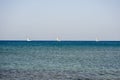 3 White boats sailing in the open blue aegean sea in Royalty Free Stock Photo