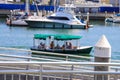 White boats and yachts at the docks in the harbor with deep blue ocean water and blue sky at Burton Chace Park