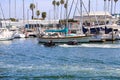 White boats and yachts at the docks in the harbor with deep blue ocean water and blue sky at Burton Chace Park