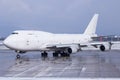 White Boeing 747-400 Jumbo Jet freighter with red tail on the ground in Graz Royalty Free Stock Photo