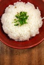 White boiled rice in a red bowl