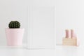 White book mockup with silk ribbons and a cactus in a pot on white table