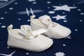 The white bootees for baby baptism party shower in Romanian tradition celebration Royalty Free Stock Photo