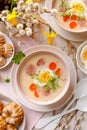 White borscht, polish Easter soup with the addition of white sausage and a hard boiled egg in a ceramic bowl, top view. Royalty Free Stock Photo