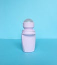 White bottle with Body antiperspirant deodorant roll-on on blue background Royalty Free Stock Photo