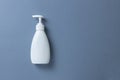 White bottle with hand soap, shower gel or body cream on gray background, mock up with place for text or copy space. Personal Royalty Free Stock Photo
