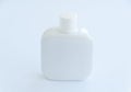 White bottle of perfume isolated on white background. Close up Royalty Free Stock Photo