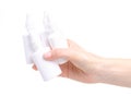 White bottles nose spray in hand Royalty Free Stock Photo