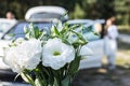 White bouquet on background of car Royalty Free Stock Photo
