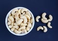 White bowl of cashew nuts Royalty Free Stock Photo