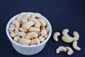 White bowl of cashew nuts Royalty Free Stock Photo