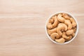 A white bowl with cashew nuts. Royalty Free Stock Photo
