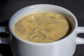 White bowl of delicious homemade cream of mushroom soup on table, closeup Royalty Free Stock Photo