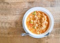 A white bowl of delicious instant noodle curry`s tast cooked on wooden table, top view image with copy space Royalty Free Stock Photo
