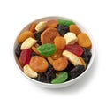 White bowl with dried fruit, tutti frutti, on white background close up