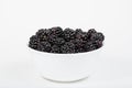 White bowl filled with black berries Royalty Free Stock Photo