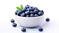 White bowl filled with fresh blueberries placed on top of table. Perfect for food-related projects