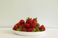 A white bowl filled with ripe straberries Royalty Free Stock Photo