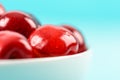 White Bowl Of Fresh Red Cherries On Turquoise Royalty Free Stock Photo