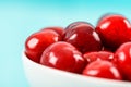 White Bowl Of Fresh Red Cherries On Turquoise Royalty Free Stock Photo