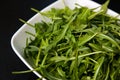 White bowl of fresh rocket salad