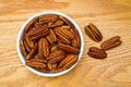 Bowl Full of Healthy Pecans on an oak table Royalty Free Stock Photo