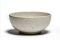 white bowl with gray glaze and small black particles, showcasing minimalist design. smooth surface and speckled pattern create Royalty Free Stock Photo