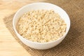 White bowl. Oatmeal porridge. Light background. Healthy food