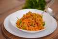 White bowl with pasta with vegetab