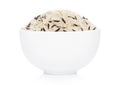 White bowl of raw organic basmati long grain and wild rice on white background. Healthy food Royalty Free Stock Photo