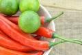 White bowl with red hot chili peppers and lemon, detail Royalty Free Stock Photo