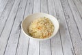 White bowl of rice three delights cooked in a Chinese restaurant with white tables Royalty Free Stock Photo