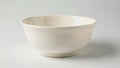 A white bowl sits on a white background Royalty Free Stock Photo