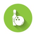 White Bowling pin and ball icon isolated with long shadow. Sport equipment. Green circle button. Vector Illustration. Royalty Free Stock Photo