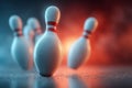 White bowling pins standing on a polished floor with dramatic lighting, creating a striking visual Royalty Free Stock Photo