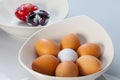 White bowls, easter eggs and golf balls Royalty Free Stock Photo