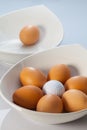 White bowls, easter eggs and golf balls Royalty Free Stock Photo