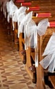 White bows in Catholic Church. Royalty Free Stock Photo