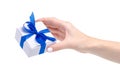 White box with blue ribbon bow gift in hand Royalty Free Stock Photo