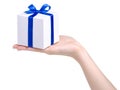 White box with blue ribbon bow gift in hand Royalty Free Stock Photo