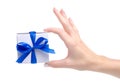 White box with blue ribbon bow gift in hand Royalty Free Stock Photo