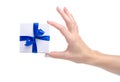 White box with blue ribbon bow gift in hand Royalty Free Stock Photo