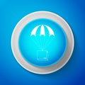 White Box flying on parachute icon isolated on blue background. Parcel with parachute for shipping. Delivery service Royalty Free Stock Photo