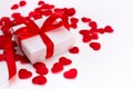 A white box with a gift in small red hearts on a white background, a template for Valentines day with a copy space, a Royalty Free Stock Photo