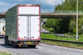 White box lorry truck on uk motorway in fast motion Royalty Free Stock Photo