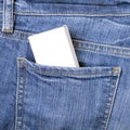 White box mockup in the back pocket of blue jeans Royalty Free Stock Photo